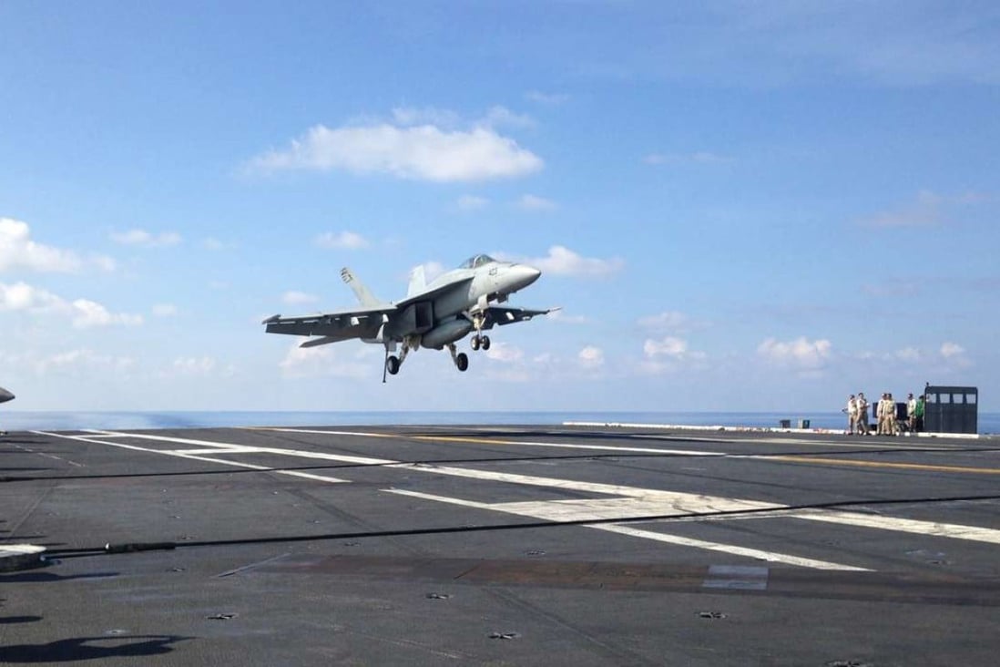 A file picture of a jet landing on the USS John C. Stennis aircraft carrier while on patrol in the South China Sea. Photo: AP