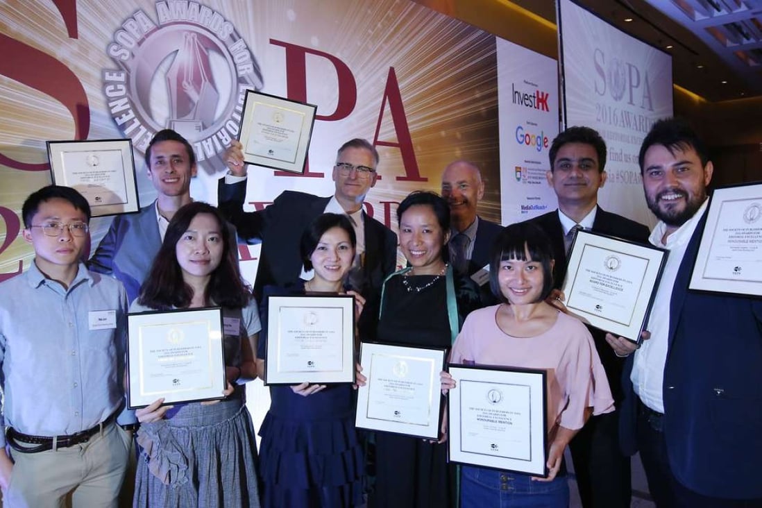 Jun Mai, He Huifeng, Minnie Chan, Verna Yu and Shirley Zhao (front row left to right) and Robin Fall, Brian Rhoads, Cliff Buddle, Debasish Roy Chowdhury and Alberto Lucas (back row) pose with awards at the SOPA awards ceremony at the Convention and Exhibition Centre in Wan Chai. Photo: Nora Tam