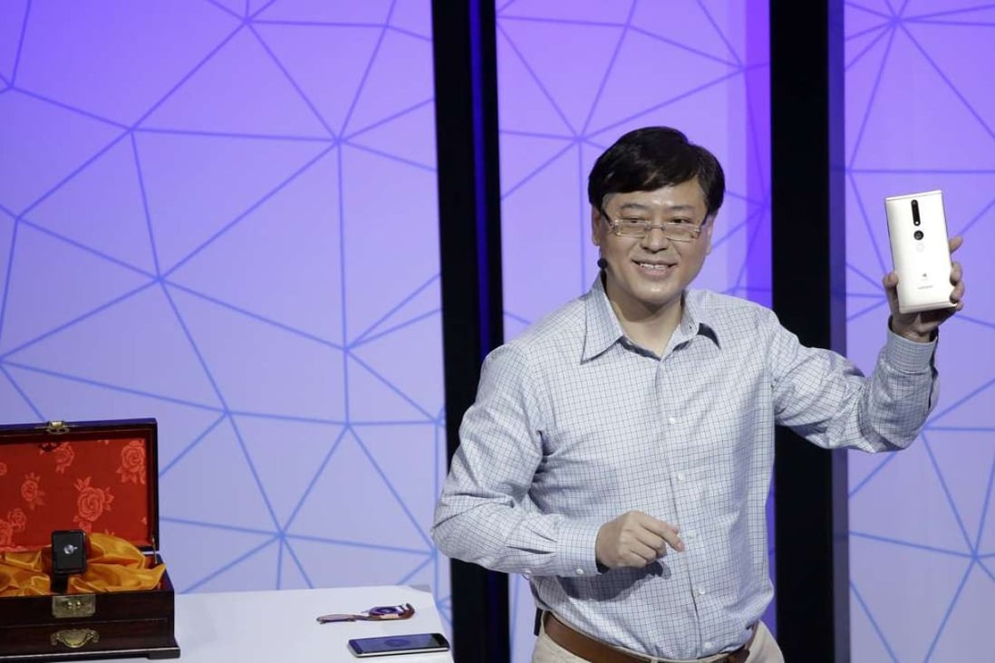 Lenovo Chairman and CEO Yuanqing Yang holds up the new Phab2 Pro phone during the keynote address at the Lenovo Tech World event on June 9, 2016 in San Francisco. Photo: AP