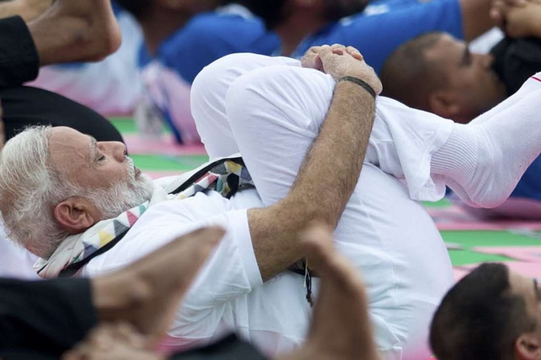 India’s Prime Minister Narendra Modi performs yoga in Chandigarh on Tuesday to mark the second International Yoga Day. Photo: AP