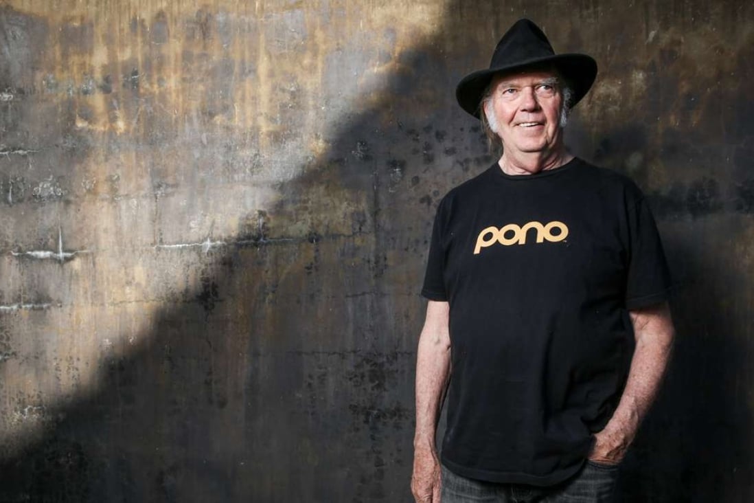 Neil Young in a shirt that promotes his high resolution digital music player. Photo: AP