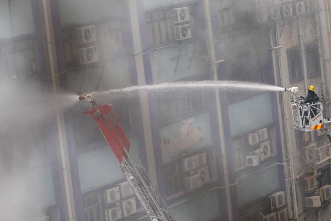 Firemen fight the blaze in Cheung Sha Wan in March 2010. Photo: David Wong