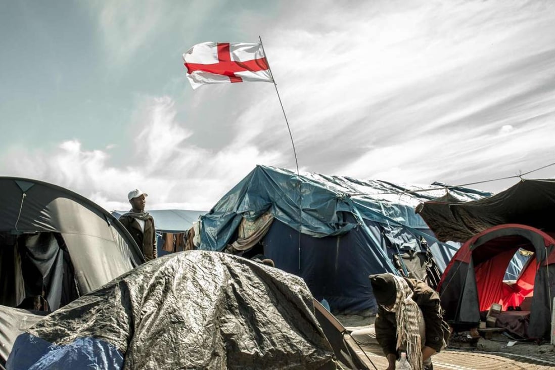 An English flag flies inside the “Jungle” camp for migrants and refugees in Calais last Friday, the day after the referendum in the UK. Concerns about immigration were among the reasons the Leave vote prevailed. Photo: AFP