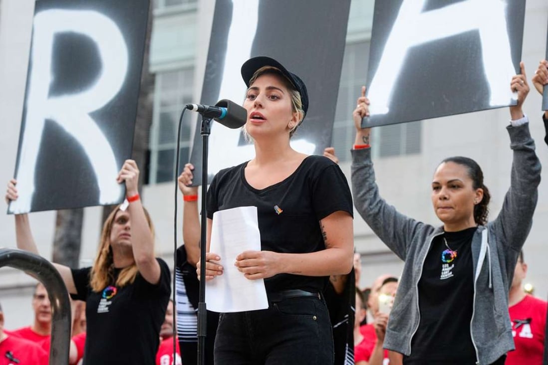 Lady Gaga reads some of the names of the victims at Los Angeles City Hall on June 13. Photo: AP
