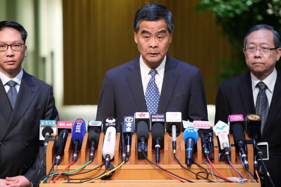 Leung (centre) meeting the press at government headquarters in Tamar on Wednesday. Photo: Sam Tsang
