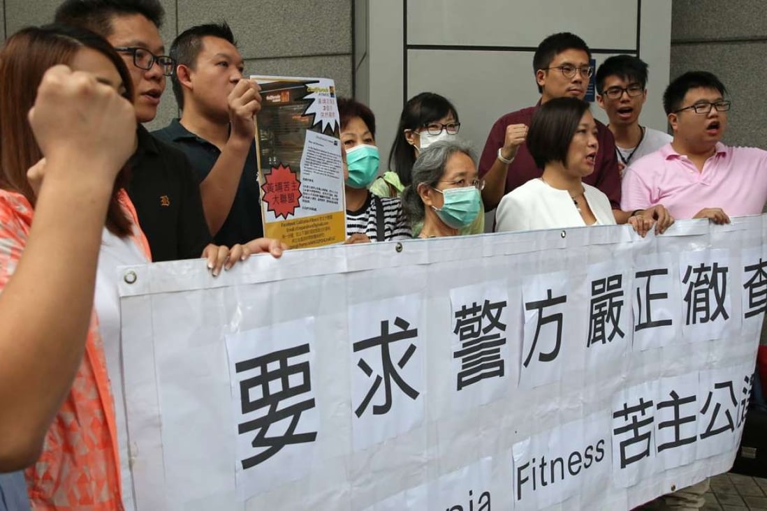 California Fitness customers with lawmaker Dr Priscilla Leung Mei-fun (front row, second from right) demanding an investigate the gym, at police headquarters in Wan Chai on Wednesday. Photo: Sam Tsang