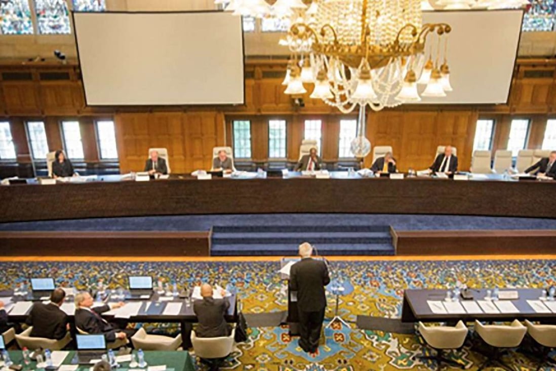 The Permanent Court of Arbitration at The Hague announce the ruling on Tuesday evening. Photo: SCMP Pictures