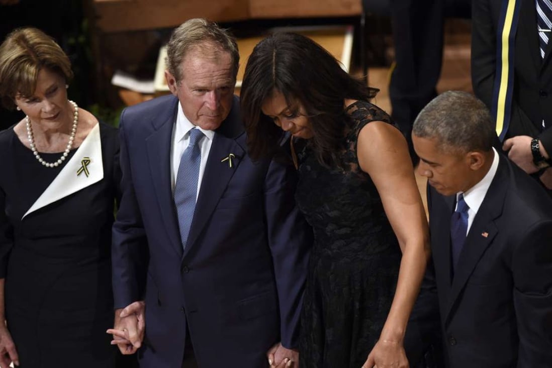 Former first lady Laura Bush, left, former President George W. Bush, first lady Michelle Obama, and President Barack Obama attend an interfaith memorial service for fallen Dallas police officers in Dallas on Tuesday. Photo: AP