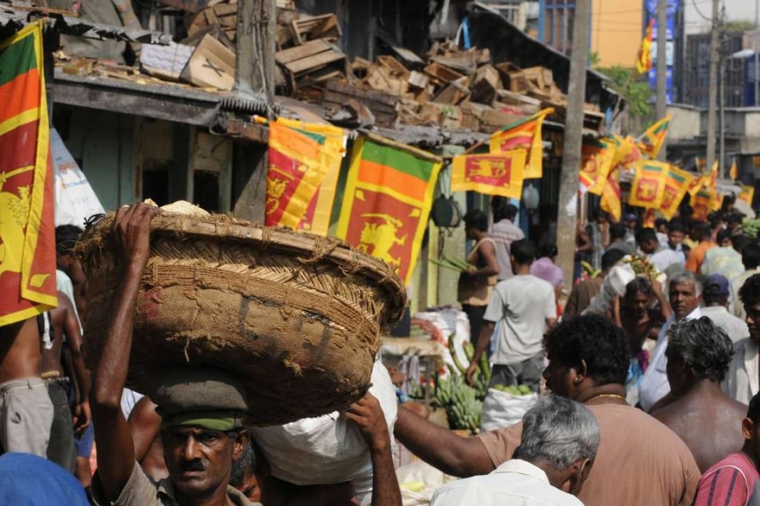 Sri Lankan national flags are seen at the main market in celebration of the country's military victory against Tamil Tiger rebels in Colombo. Picture: AFP