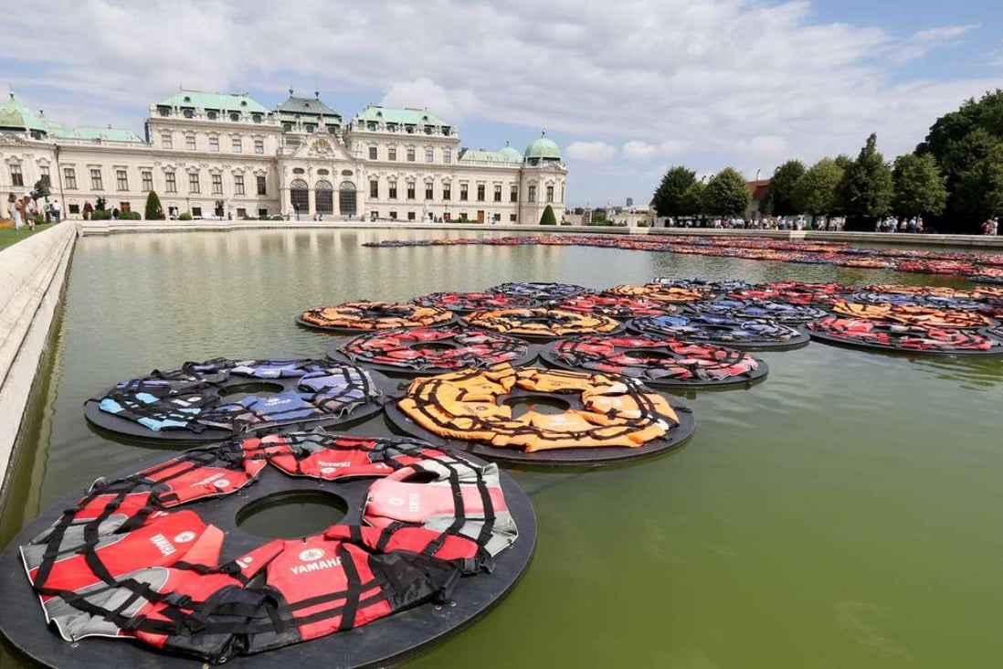 Chinese artist Ai Weiwei’s installation F Lotus, made of life vests floating on the pond at Vienna’s Belvedere Palace. Photo: AP