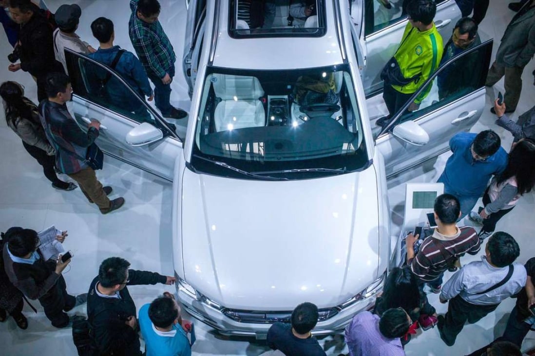 People gather at the Haval stand at the Beijing Auto Show in Beijing on April 27, 2016. SUVs accounted for 34.9 per cent of China’s personal vehicle market in the first half of the year. Photo: AFP