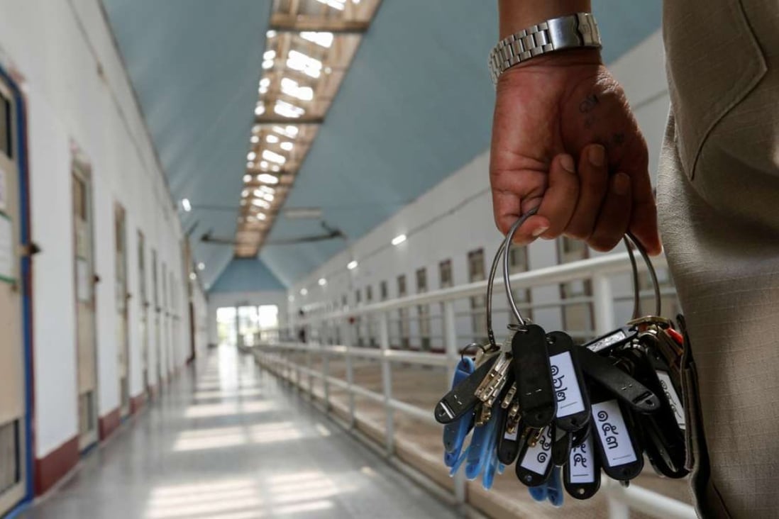 A guard holds keys in the long-term sentence zone inside Klong Prem high-security prison in Bangkok. Photo: Reuters