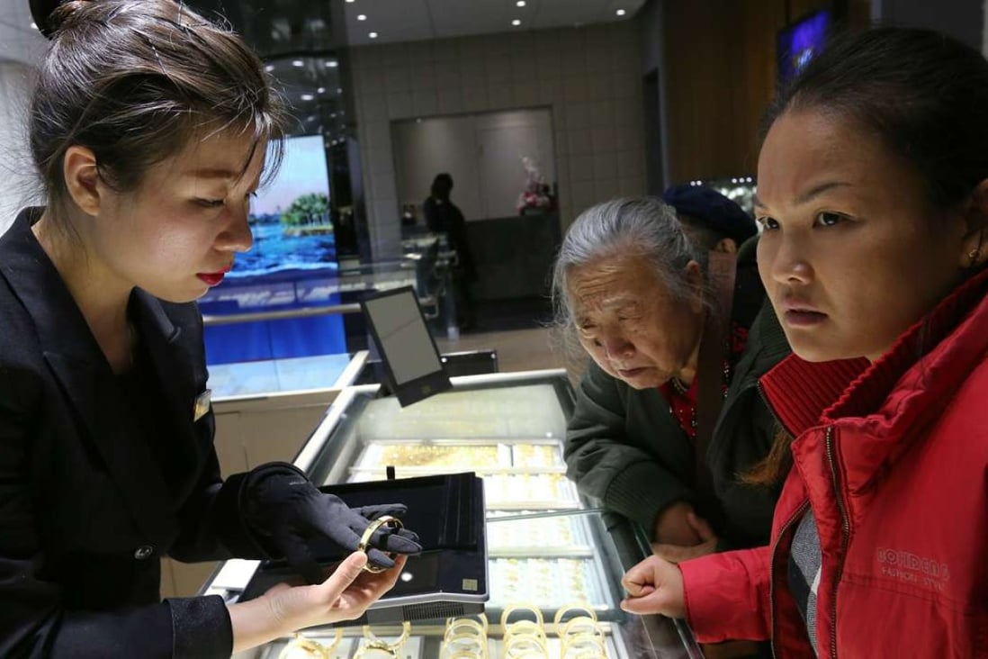 People buy gold jewellery at Chow Tai Fook. Photo: SCMP