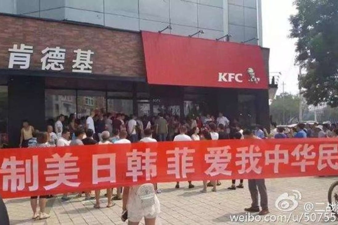 Dozens of protesters gathered outside a KFC outlet in Laoting county in Hebei province on Sunday. Photo: SCMP Pictures