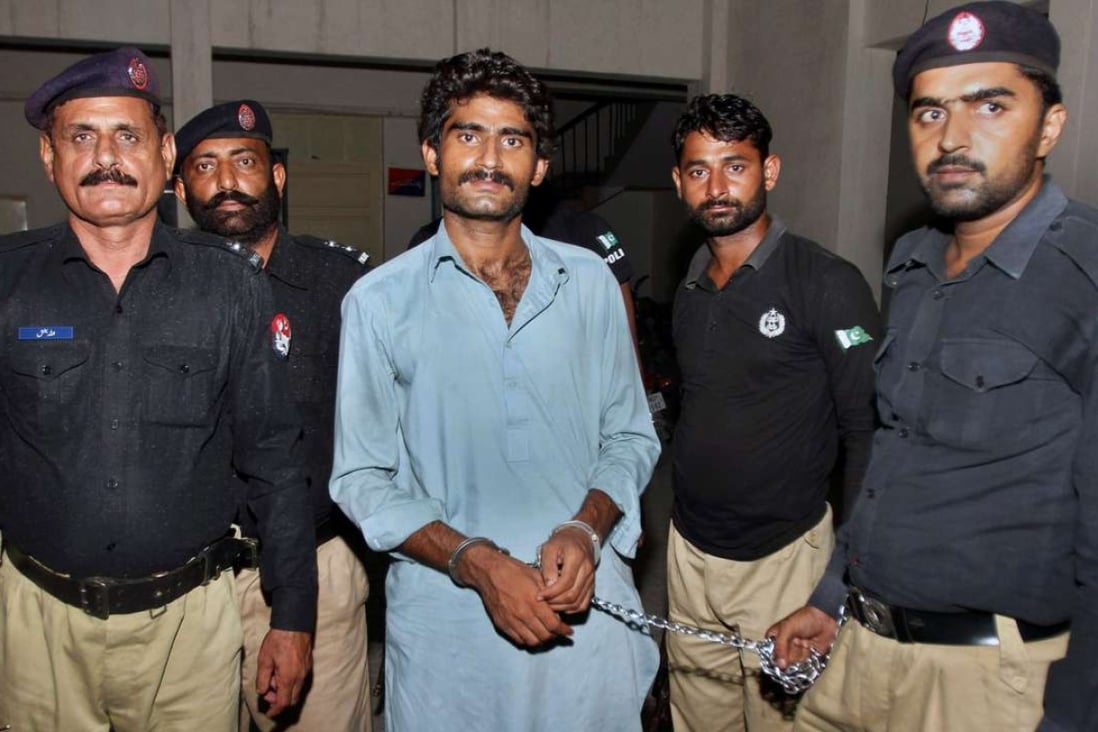 Pakistani police officers present Waseem Azeem, the brother of slain model Qandeel Baloch. Photo: AP