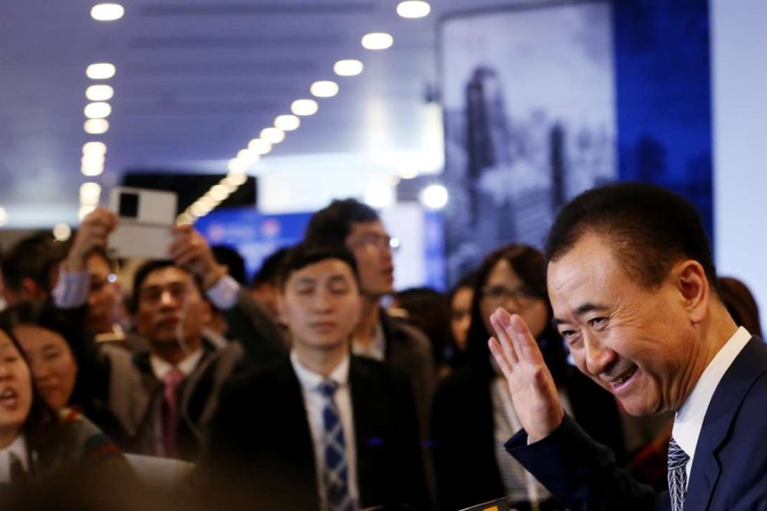 Wang Jianlin, chairman of Dalian Wanda Group, speaks to the media after attending the Asian Financial Forum in Hong Kong in January. His company has made it into the Fortune 500 for the first time. Photo: Nor Tam, SCMP