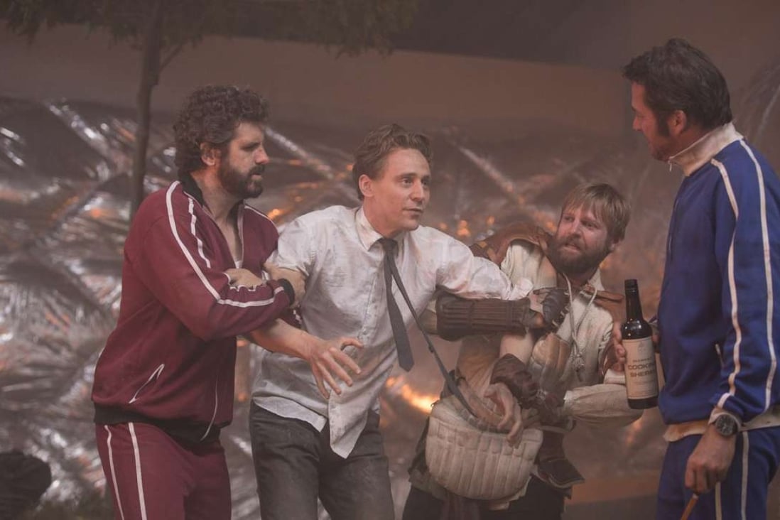 Tom Hiddleston (centre) in a still from High-Rise.