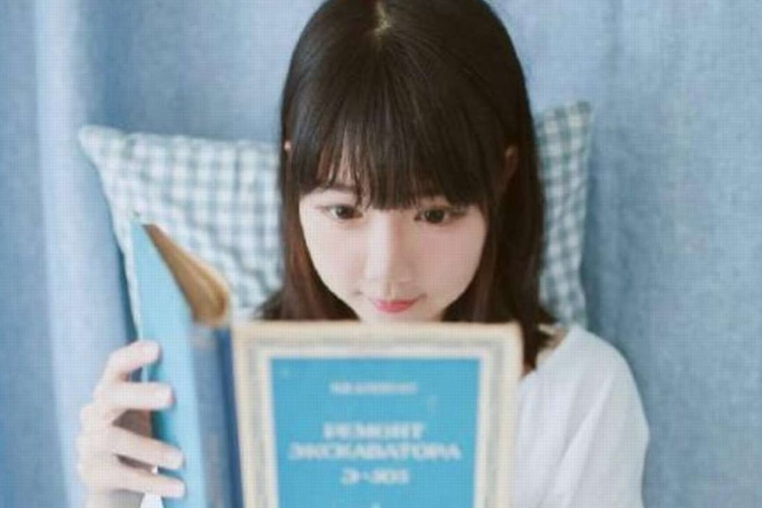 Portraits of a young woman reading a manual for an old Russian excavator have brought her instant fame online. Photo: SCMP Pictures