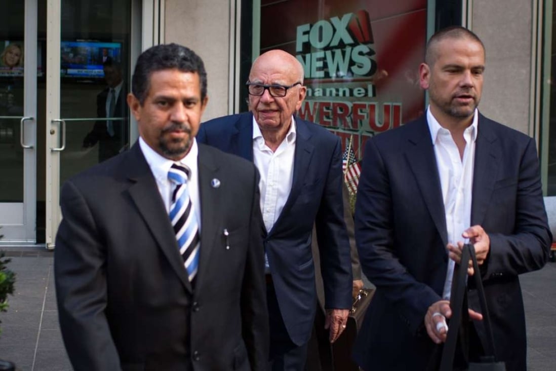 Rupert Murdoch (centre) and son Lachlan Murdoch (left) leave the News Corporation building on Thursday in New Yorkafter Fox News CEO Roger Ailes departed the company. Photo: AFP