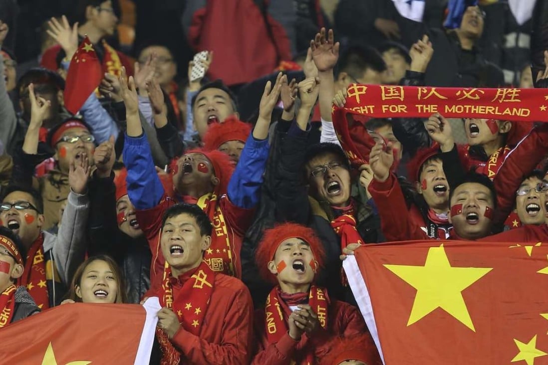 Football has Chinese fans cheer during a Group C qualifier match of the AFC Cup between China and Saudi Arabia held in Xi'an in northwest China's Shaanxi province on November 19, 2013. Photo: AP