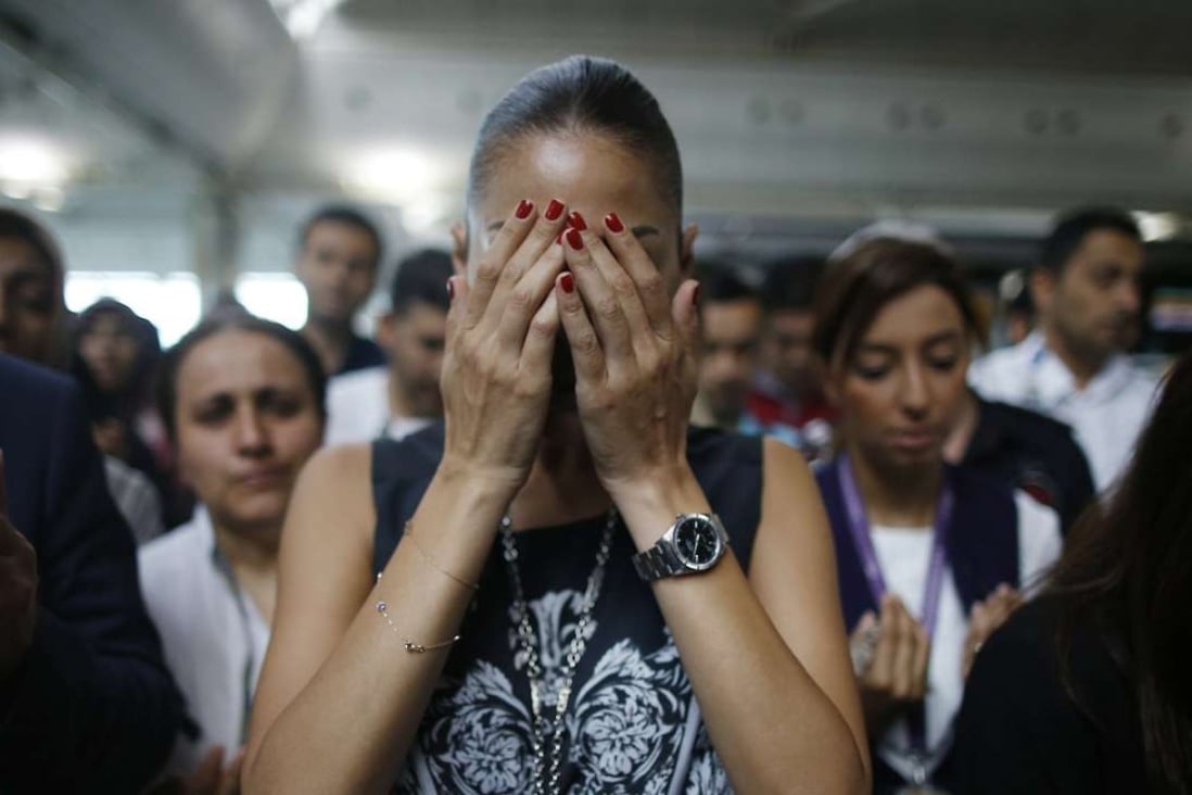 Family members, colleagues and friends of the victims of the bomb attack last month at Ataturk Airport in Istanbul gather for a memorial ceremony. The attack killed dozens and injured over 200. Photo: AP