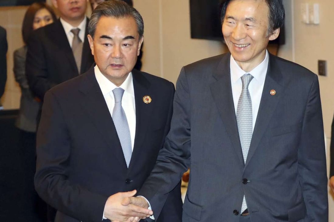 China’s Foreign Minister Wang Yi (left) met South Korea’s Foreign Minister Yun Byung-se on the sidelines at Sunday’s Asean forum on Sunday. Photo: EPA