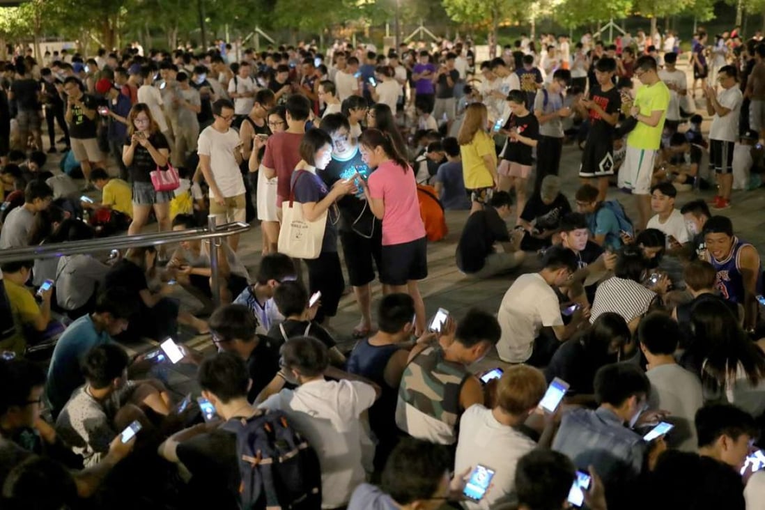 Tin Sau Road Park in Tin Shui Wai at night is a sea of Pokemon trainers.