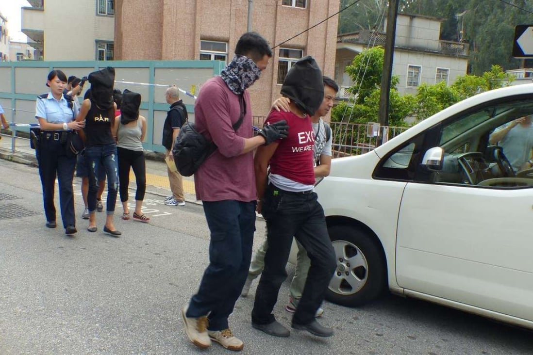 Police arrested 13 people from two cars in Yuen Long. Photo: SCMP Pictures