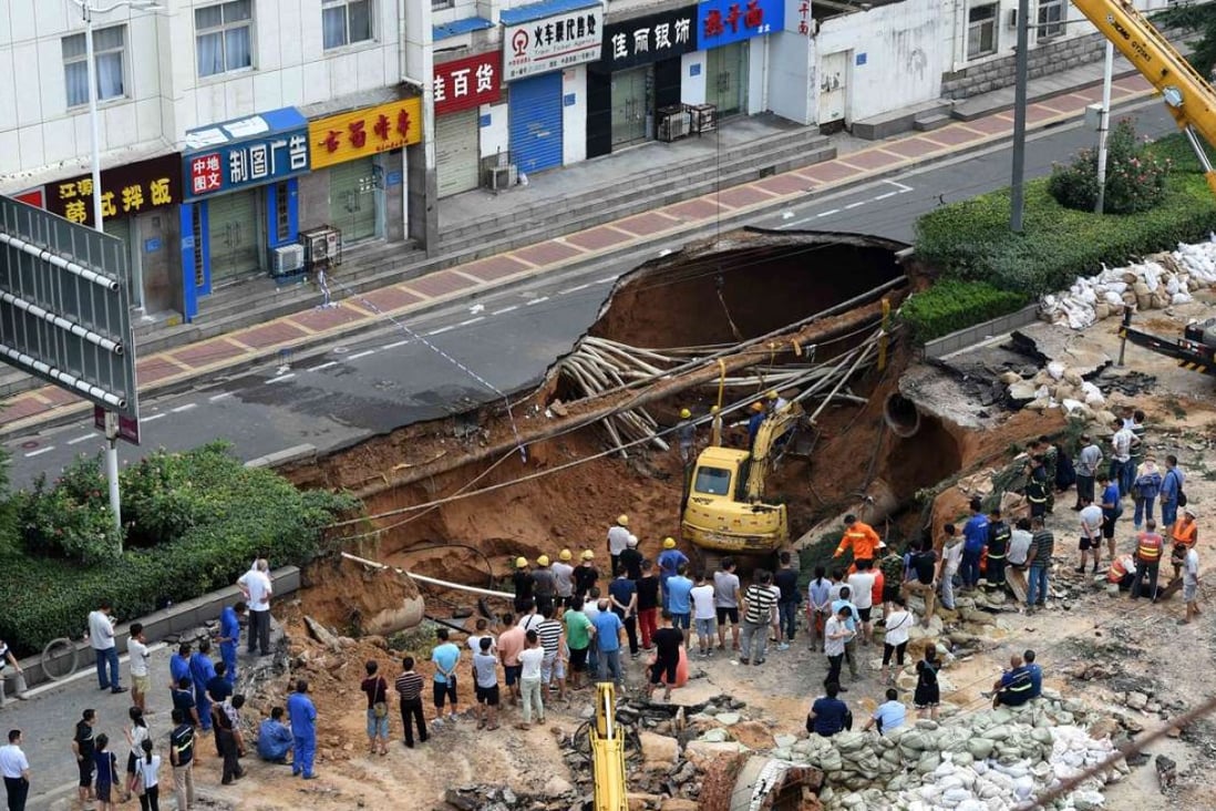 The huge sinkhole was caused by heavy rainfall and a burst underground water pipe, Zhengzhou officials say. Photo: SCMP Pictures
