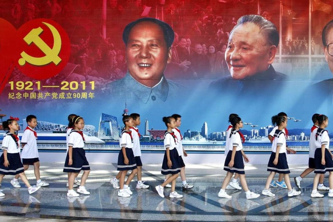 In this file photo from 2011, young pioneers of the Communist Youth League take part in a party celebration. Photo: AFP