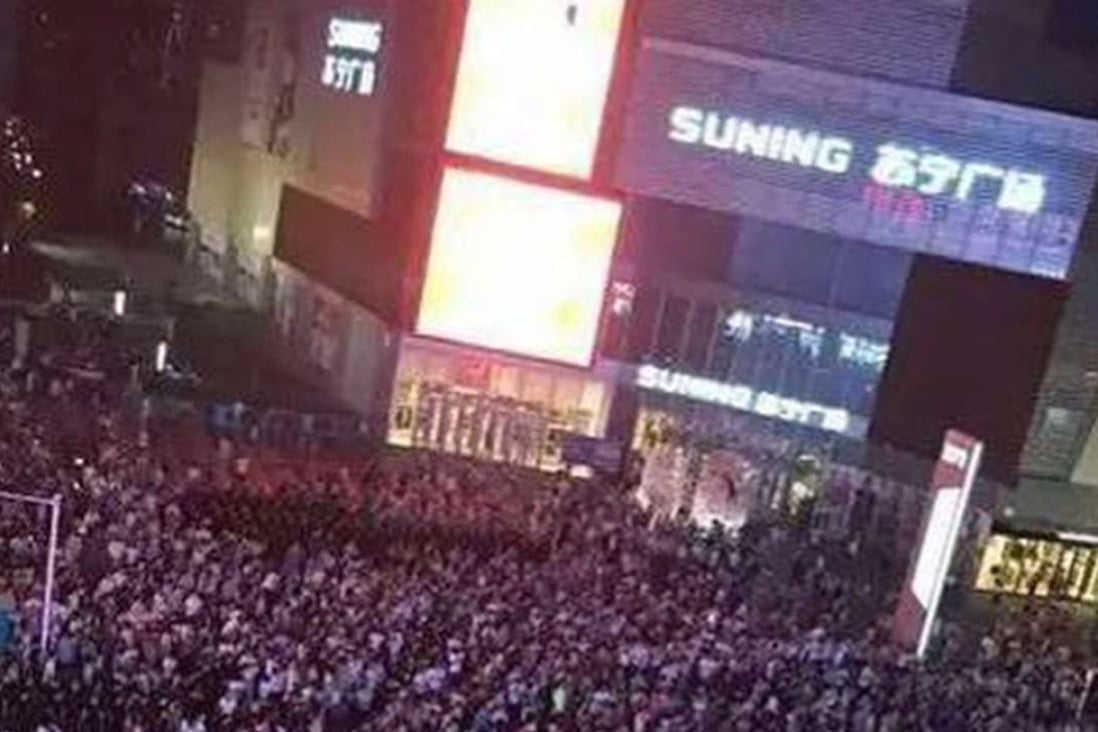 Crowds fill a square in downtown Lianyungang in Jiangsu province on Saturday, despite warnings from police that the protest organisers had not received permission for the gathering. Photo: SCMP Pictures