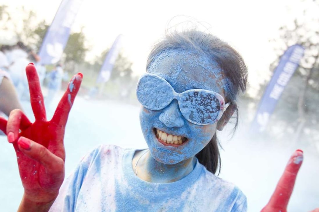 In the party-style Colour Run participants end up covered head-to-toe in brightly coloured powder. Photo: EPA