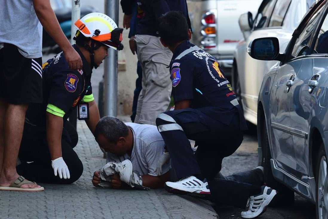 Thai rescue workers attend to an injured man after a small bomb exploded in Hua Hin on Friday after the overnight blast. Photo: AFP