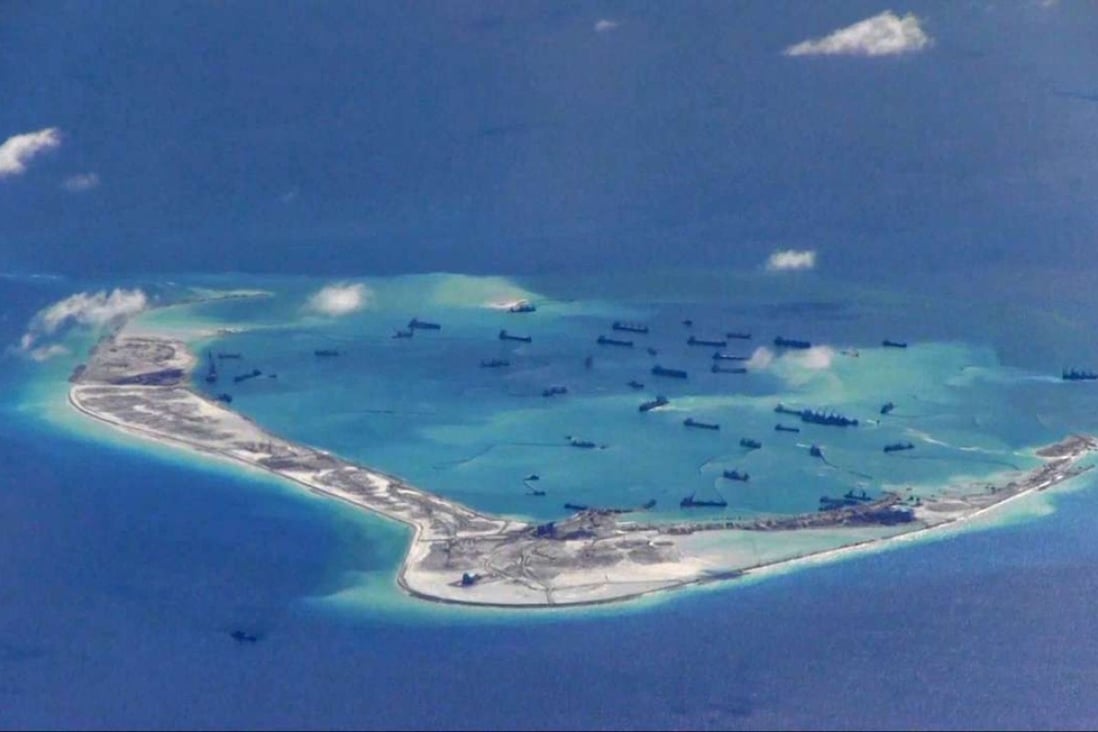 Chinese dredging vessels are purportedly seen in the waters around Mischief Reef in the Spratly Islands in the South China Sea in this image from video taken by the US Air Force and provided in May last year. Photo: Reuters