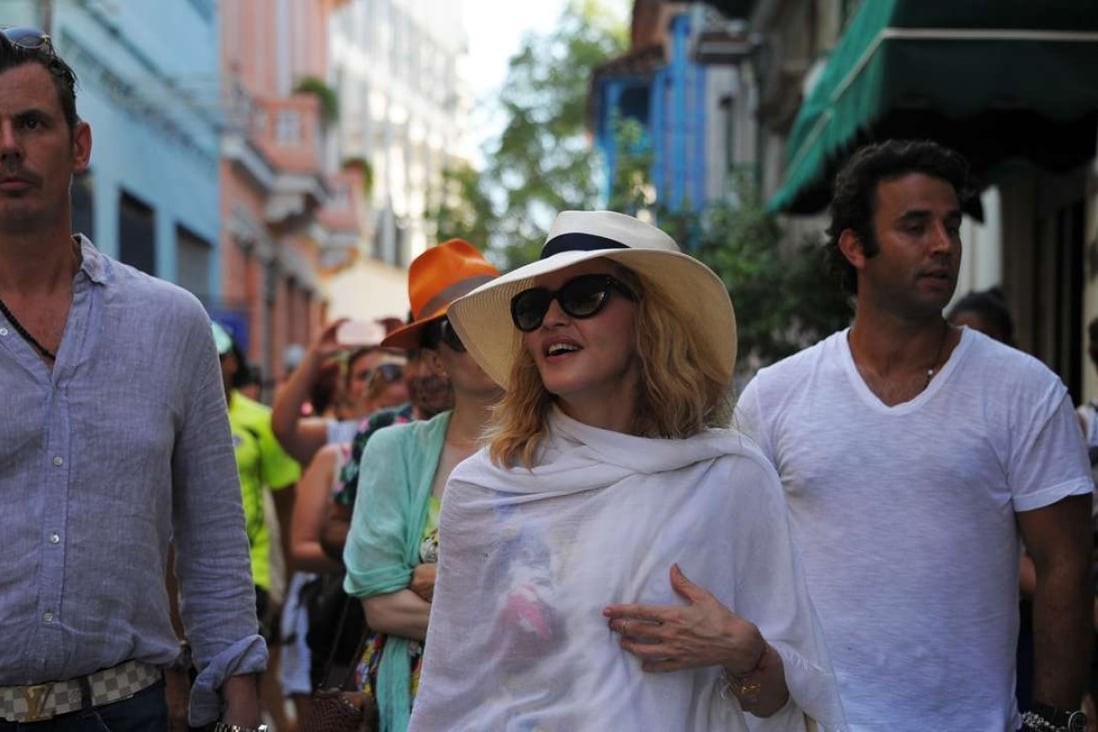 Madonna walks along a street in Havana, where she is celebrating her 58th birthday. Photo: AFP
