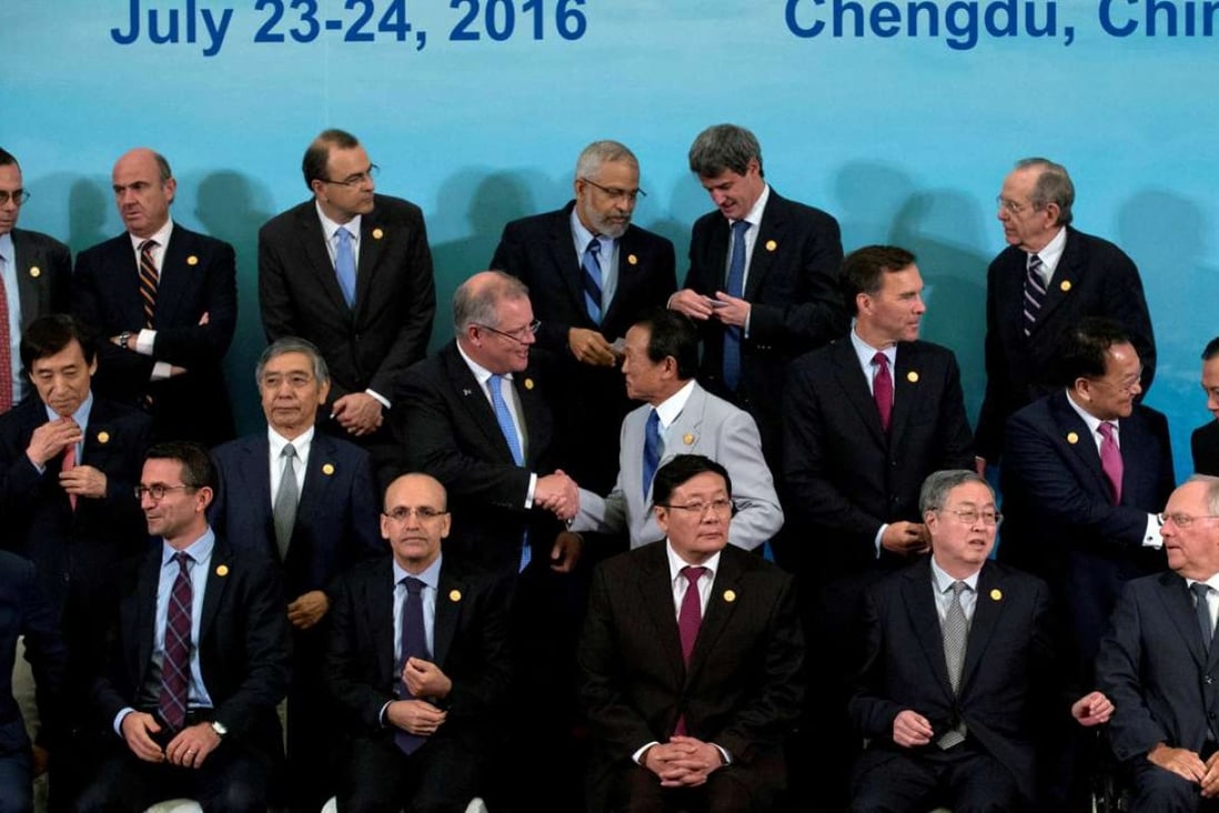 G20 finance ministers and central bank governors prepare for a group photo in Chengdu in China's Sichuan province, July 24, 2016. Photo: Reuters