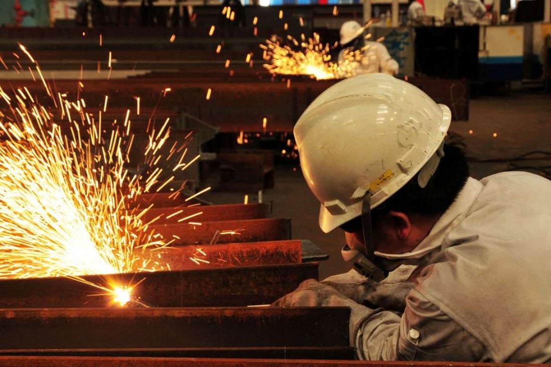 A worker welds at a marine petroleum platform in Qingdao, Shandong province. The reform of SOEs is the biggest uncertainty in retooling the world’s No 2 economy. Photo: Reuters