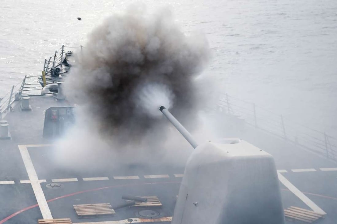 The Arleigh Burke-class guided-missile destroyer USS Stethem conducts a firing exercise in the South China Sea in July. Photo: AFP