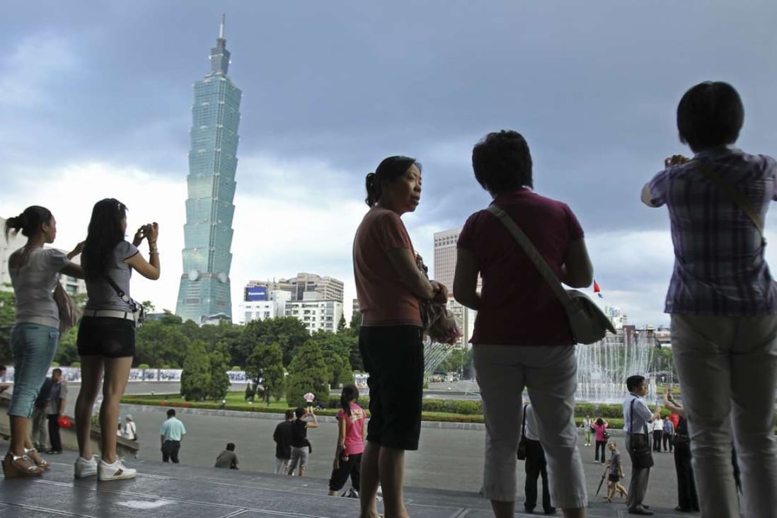 In this file photo, Chinese tourists visit the Sun Yat-sen park in Taipei, Taiwan. The number of mainland visitors fell in the second quarter of the year. Photo: AP