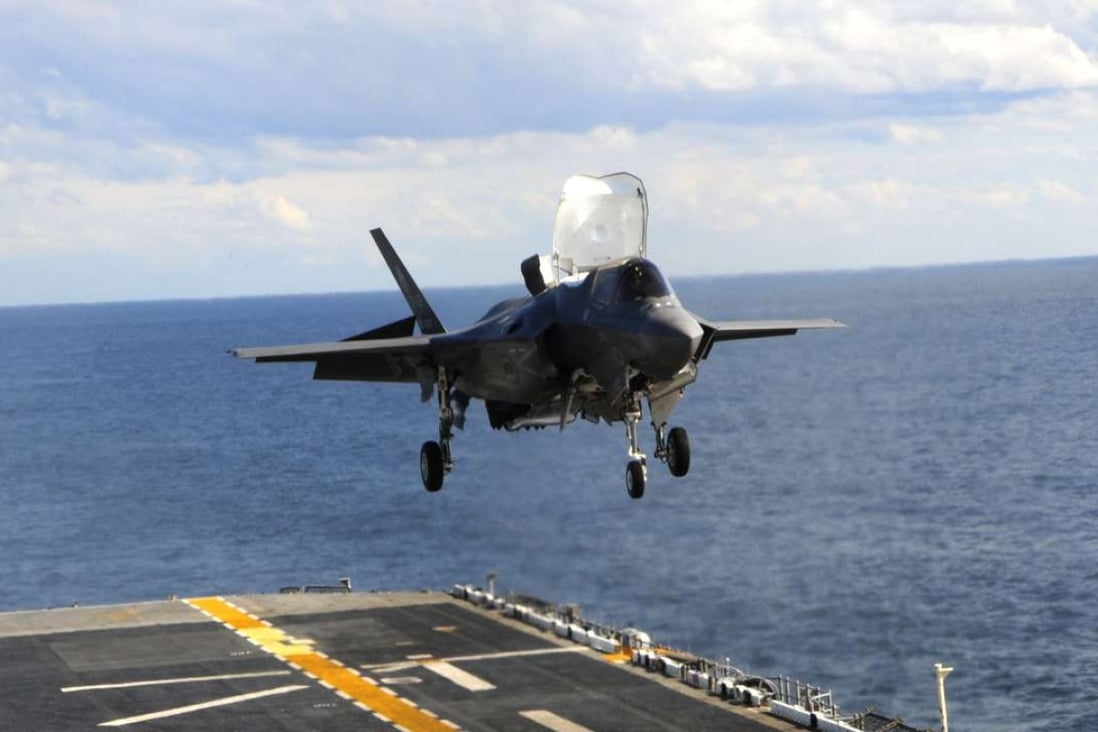 An F-35B makes its first vertical landing on a flight deck at sea in this 2011 test. File photo: AFP