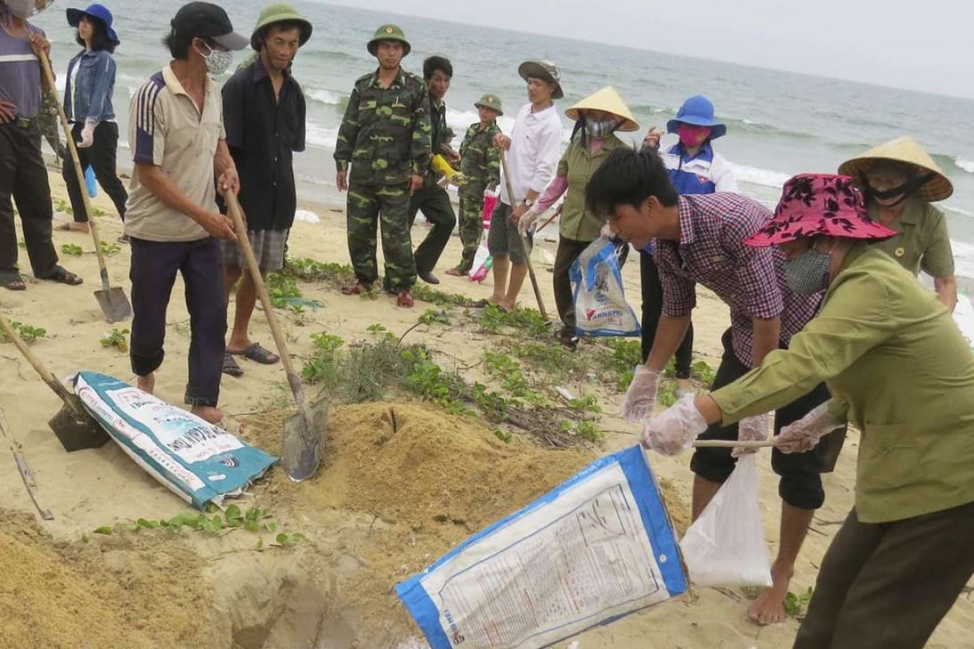 Vietnam says it’s now safe to swim at most central beaches after toxic
