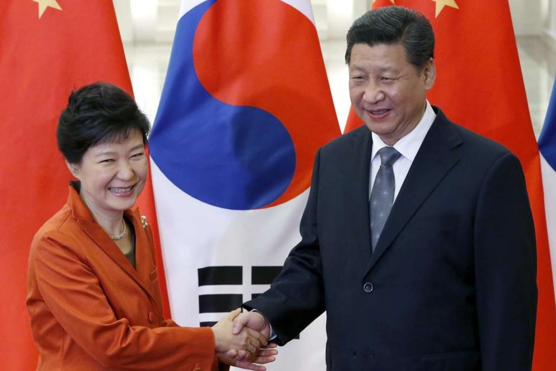 President Xi Jinping shakes hands with South Korean President Park Geun-hye during a meeting at the Great Hall of the People in Beijing on the sidelines of the 2014 Apec summit. Photo: EPA