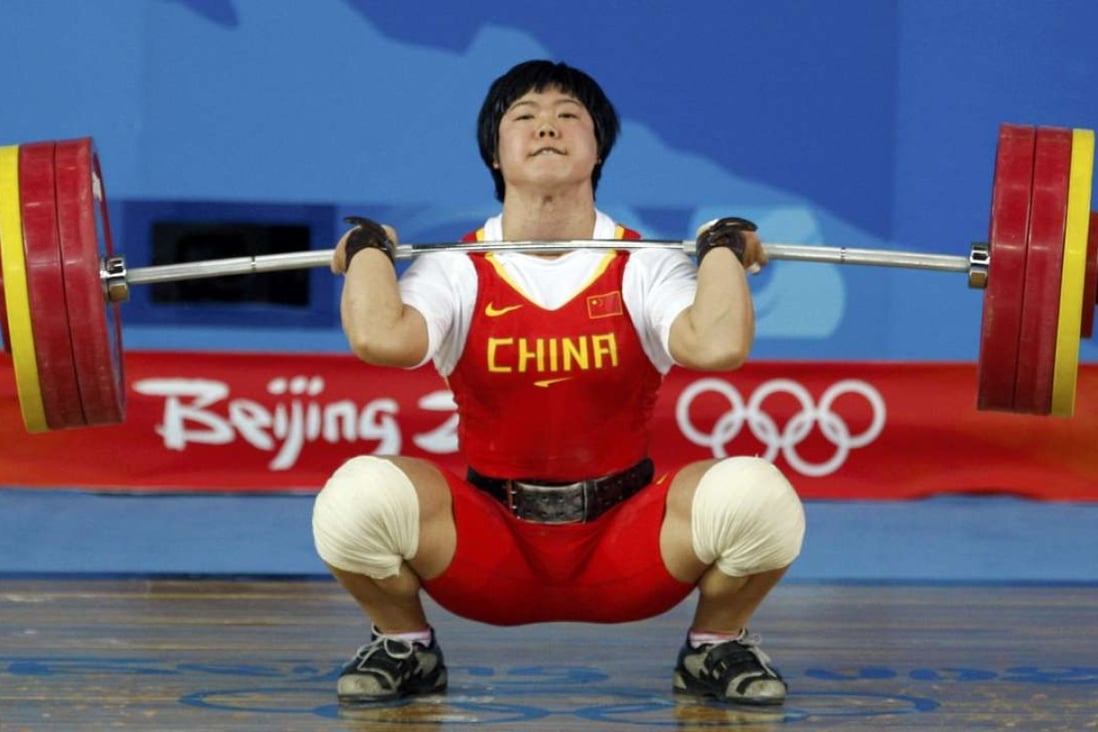 Liu Chunhong of China lifts 158kg to set a world record in the women’s 69kg clean & jerk at the Beijing 2008 Olympic Games. Photo: Reuters