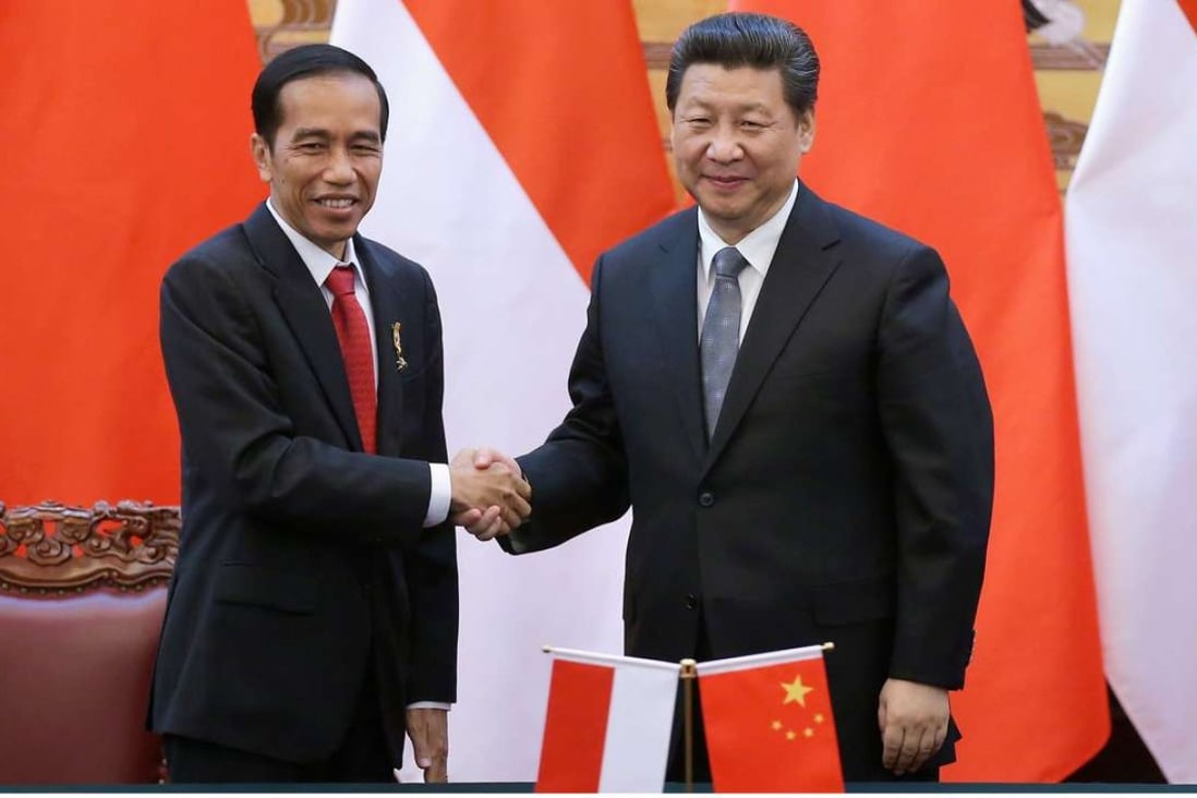 Indonesian President Joko Widodo shakes hands with President Xi Jinping at the Great Hall of the People in Beijing in March last year. Photo: EPA