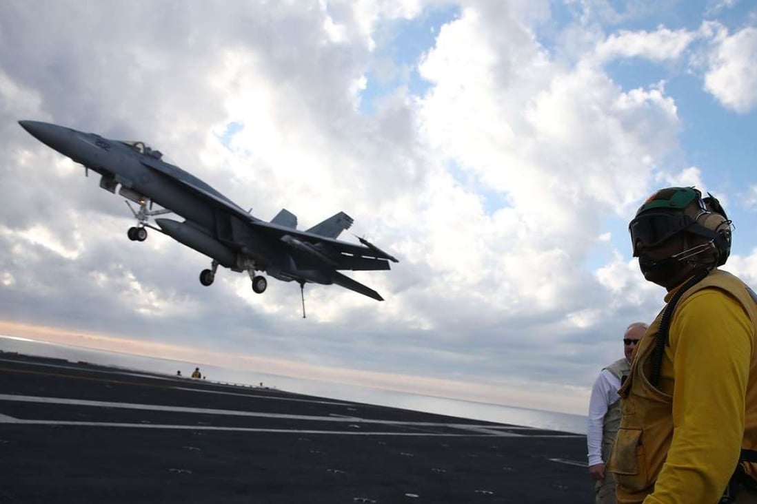 An F/A-18 Super Hornet prepares to land on the deck of the USS Eisenhower off the coast of Virginia in December, 2015 in the Atlantic Ocean. US Defence Secretary Ash Carter visited the carrier with India's Minister of Defence Manohar Parrikar to demonstrate US Navy aircraft carrier flight operations. Photo: AFP