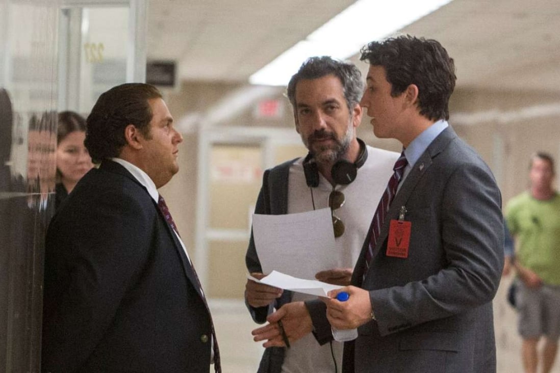 Director Todd Phillips (middle) with actors Jonah Hill (left) and Miles Teller on the set of War Dogs.