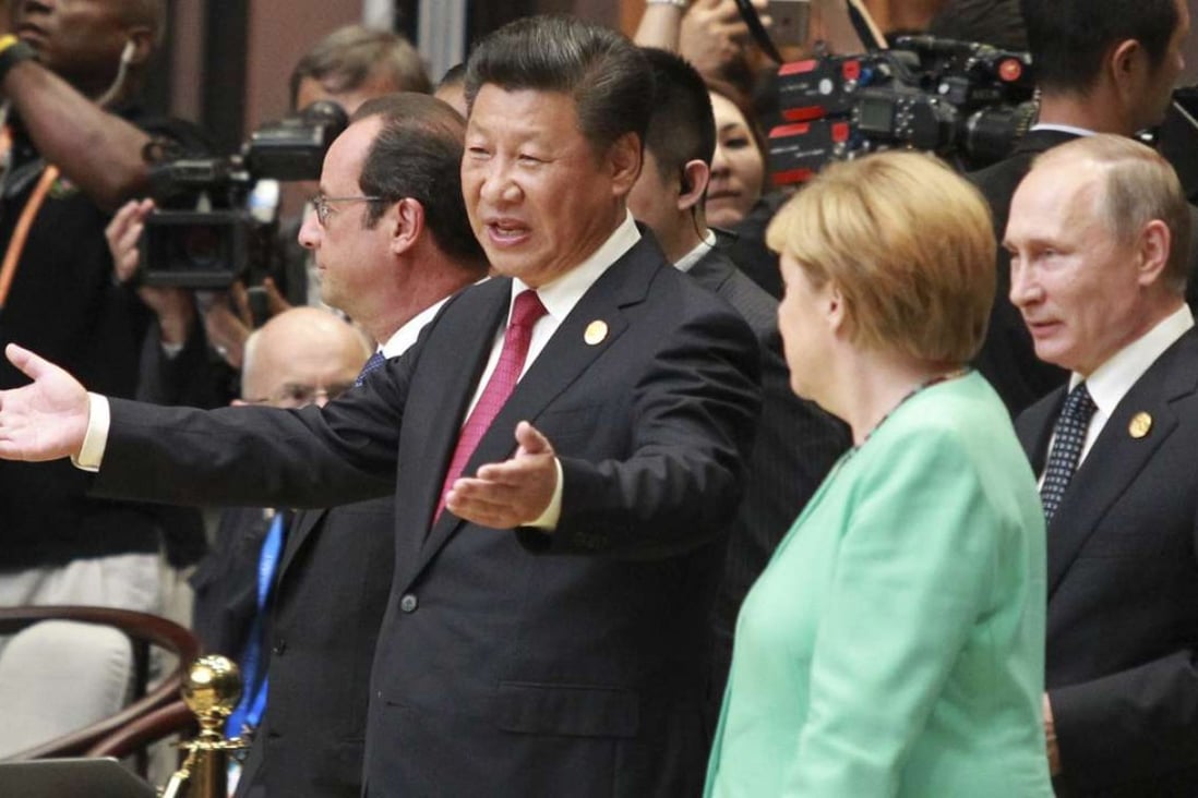 President Xi Jinping and German Chancellor Angela Merkel, French President Francois Hollande, and Russia President Vladimir Putin walk into the main G20 hall in Hangzhou on Sunday. Photo: Simon Song