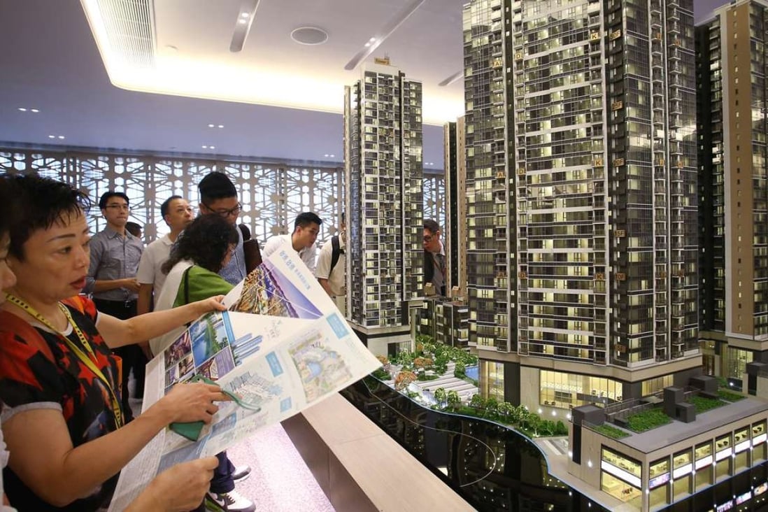 Potential buyers attend sales office of the One Kai Tak development at Exchange Tower in Kowloon Bay. Photo: Dickson Lee