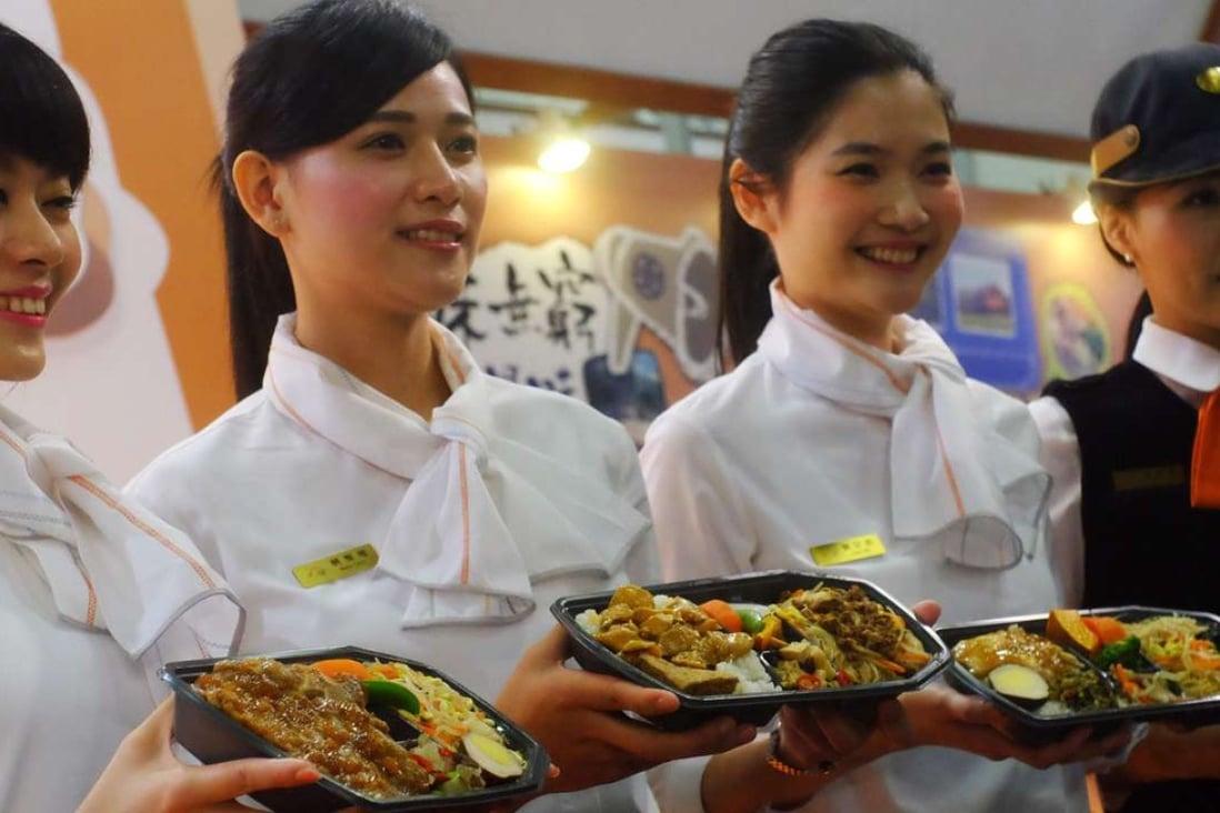 Train attendants from different routes show off their lunch boxes during the 2016 Taiwan Culinary Exhibition in Taipei. Once served as no-frills sustenance for train travellers in Taiwan, simple rice lunch boxes are selling in their millions across the island, a food trend fuelled by nostalgia. Photos: AFP