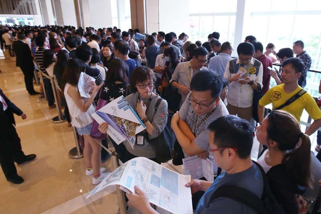 Potential buyers queuing at the sales office of China Overseas Land's One Kai Tak development in Kowloon Bay on September 3. Photo: Felix Wong